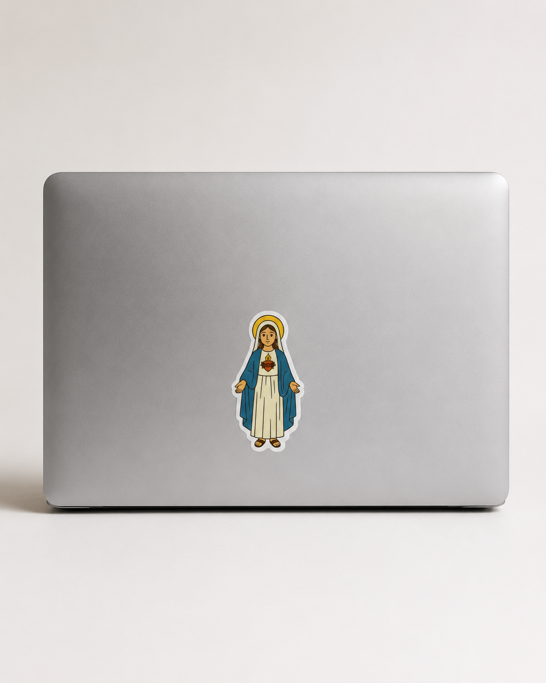 Immaculate Heart of Mary vinyl sticker on a computer.