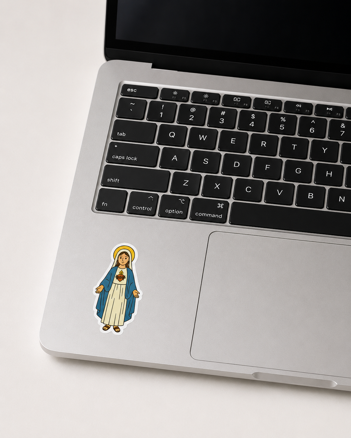 Immaculate Heart of Mary vinyl sticker on a computer keyboard