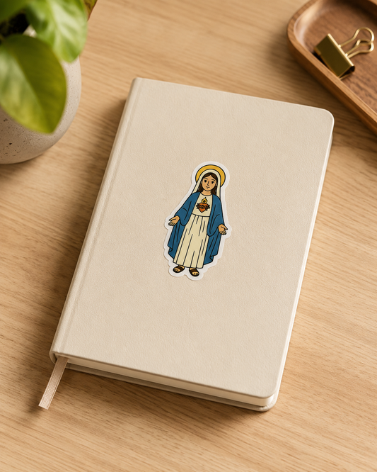 Immaculate Heart of Mary vinyl sticker on a notebook