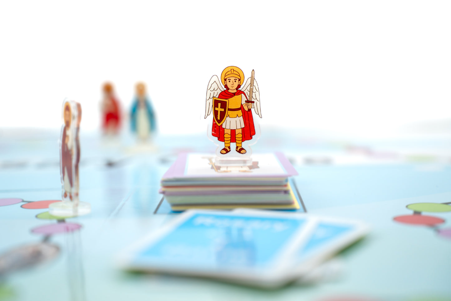 Acrylic saint figures included in the Rosary Game